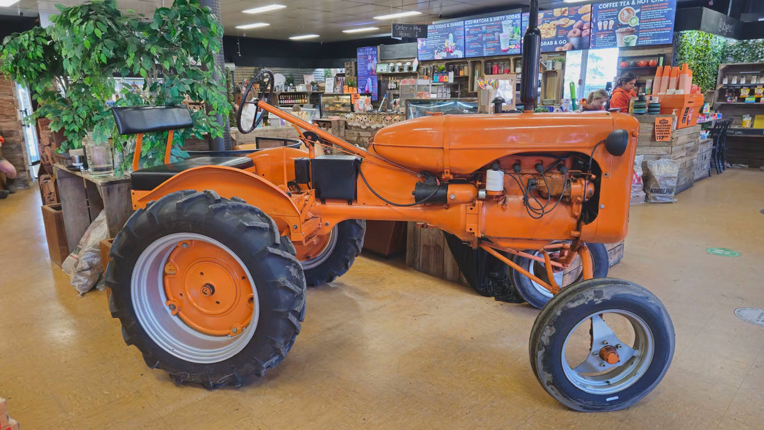 Chug the orange tractor at Upper Beaconsfield General Store